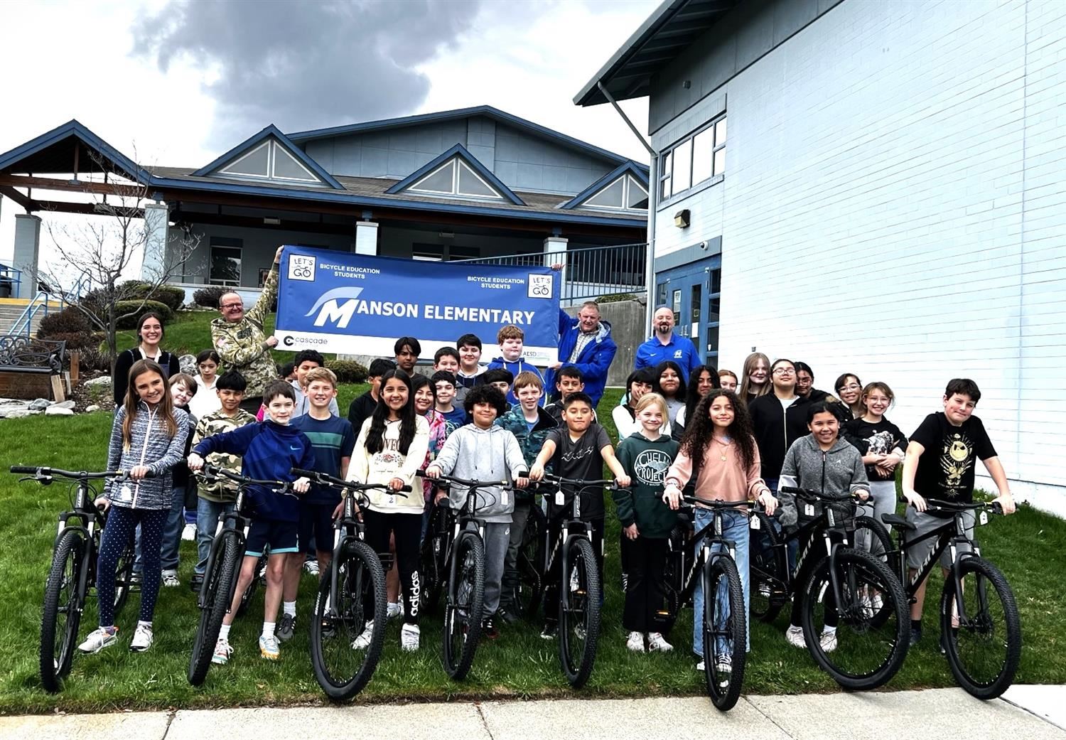  Fifth graders at Manson Elementary School received new mountain bikes and helmets as part of the "E
